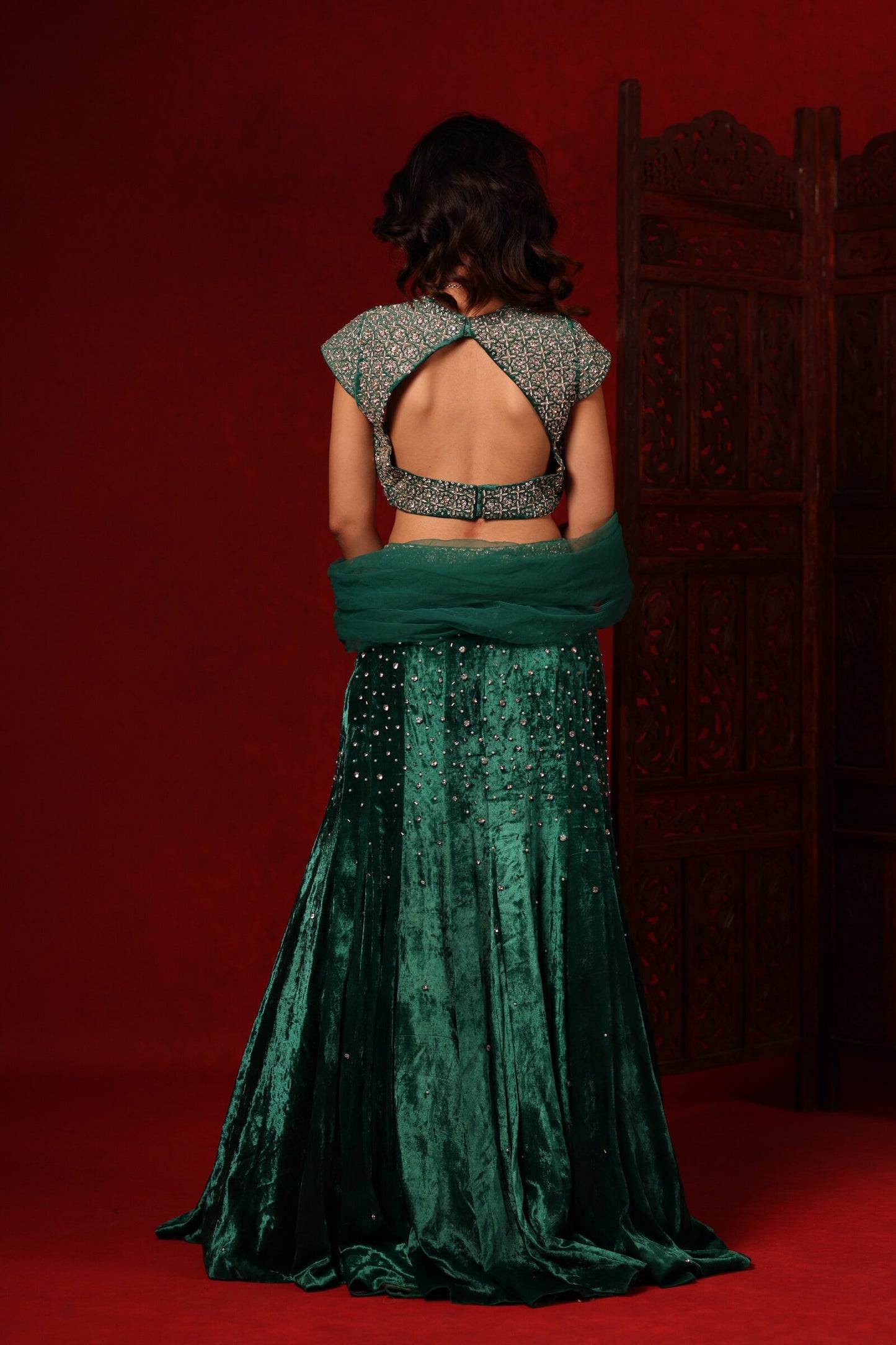 Emerald green velvet hand embroidered lehenga set
