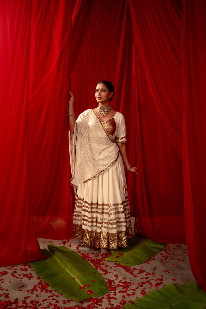 Tripura Ivory White Real Lampa Gold Lehenga Set