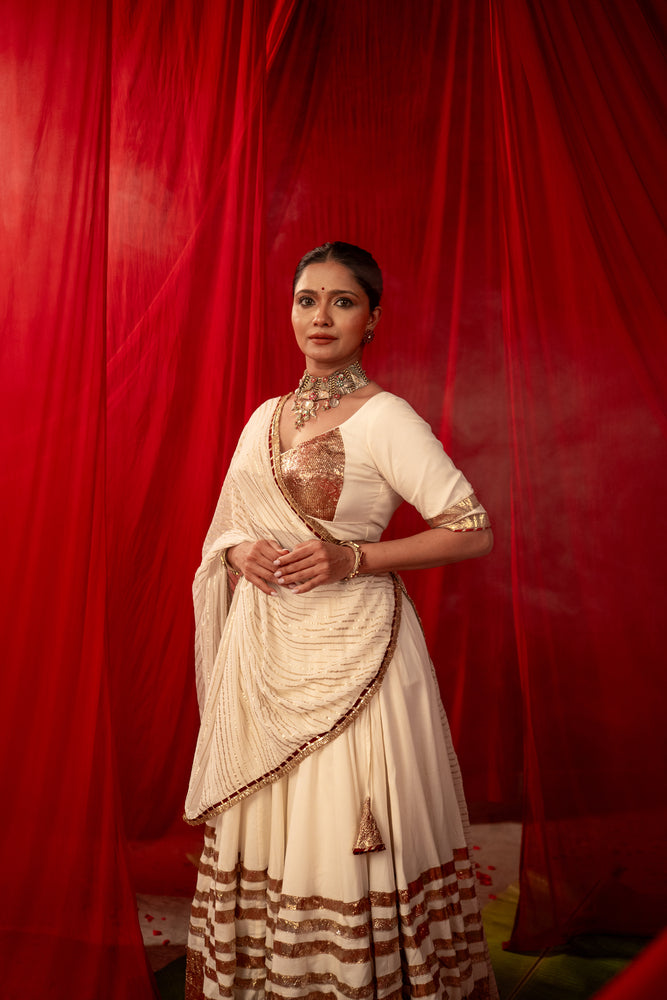 Tripura Ivory White Real Lampa Gold Lehenga Set